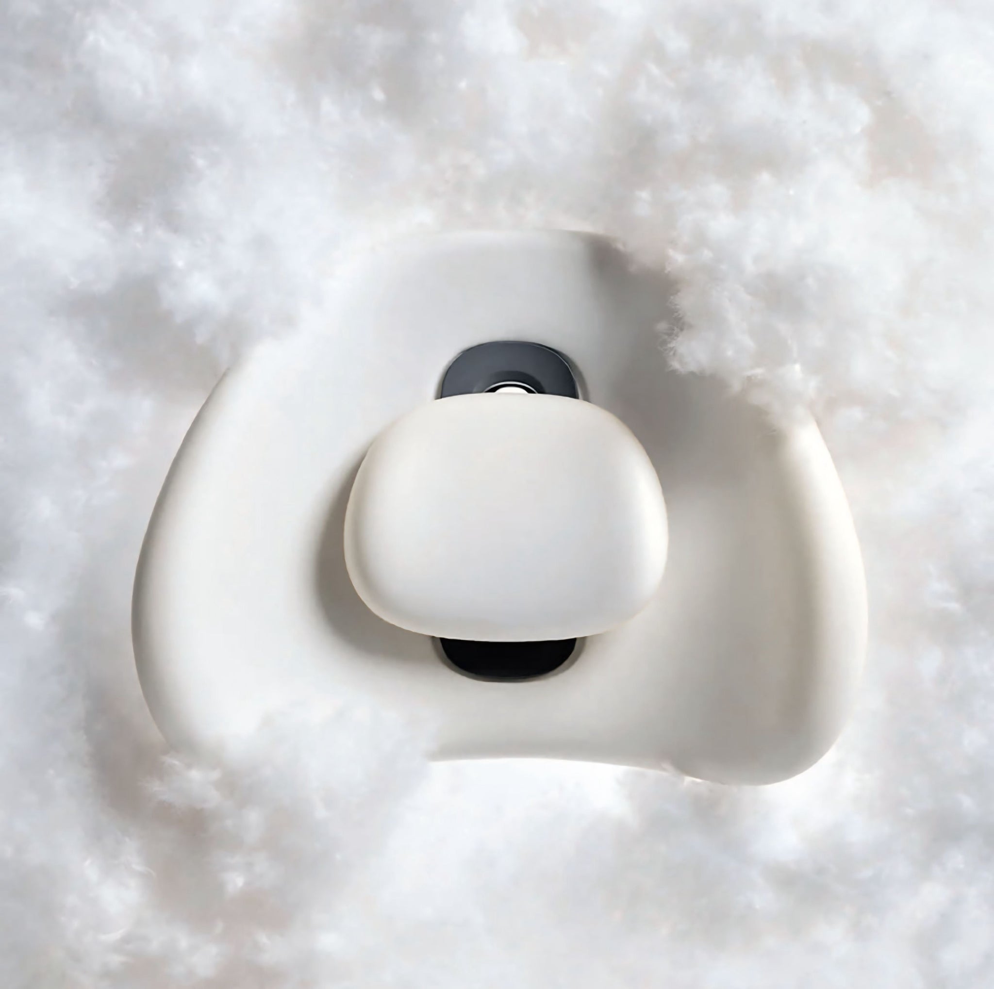 “NuVibe™ x CICIDO ErgoLuxe Cushion surrounded by fluffy white cotton, highlighting its ultra-soft, cloud-like comfort.